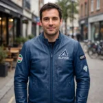 Alpine Leather Jacket model view — front-facing model wearing the dieppe blue jacket with chest embroidery