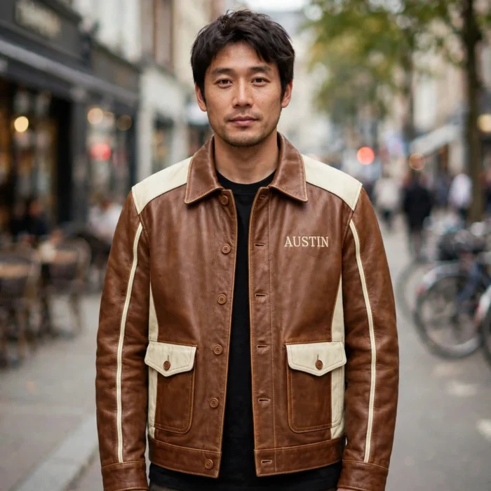 Man wearing the Austin Leather Jacket outdoors, front-facing, showing the heritage cruiser jacket and chest embroidery