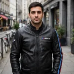 Model wearing the BMW M Leather Jacket, black with light-blue, navy and red M stripes racer jacket
