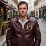 Citroën DS Leather Jacket model view — front-facing model wearing the deep burgundy jacket with chest embroidery