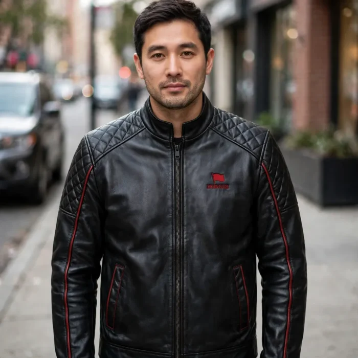 Person wearing the Hongqi Leather Jacket outdoors, front-facing, showing small red flag emblem with 'hongqi' text embroidered on the left chest