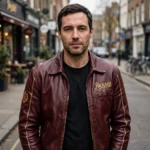 Model wearing the Packard Leather Jacket, deep maroon with gold vintage script chest lettering vintage cruiser jacket
