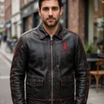 Model wearing the Pontiac Leather Jacket, black with red arrowhead-style chest emblem and vintage red trim vintage racer jacket