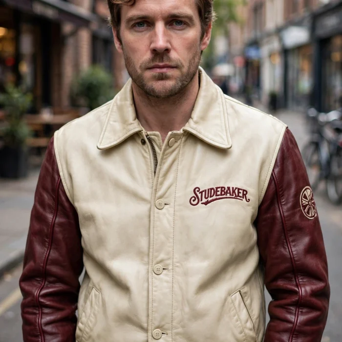 Model wearing the Studebaker Leather Jacket, cream-and-burgundy two-tone with vintage script chest lettering vintage cruiser jacket